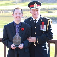 Brad Duncan in uniform with worker
