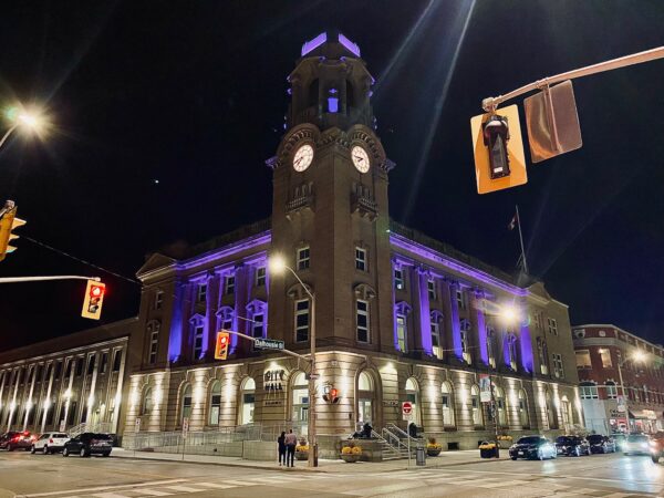 Brantford, Ontario City Hall illuminated purple and blue.